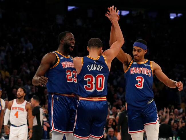 Draymond Green, Stephen Curry y Jordan Poole.