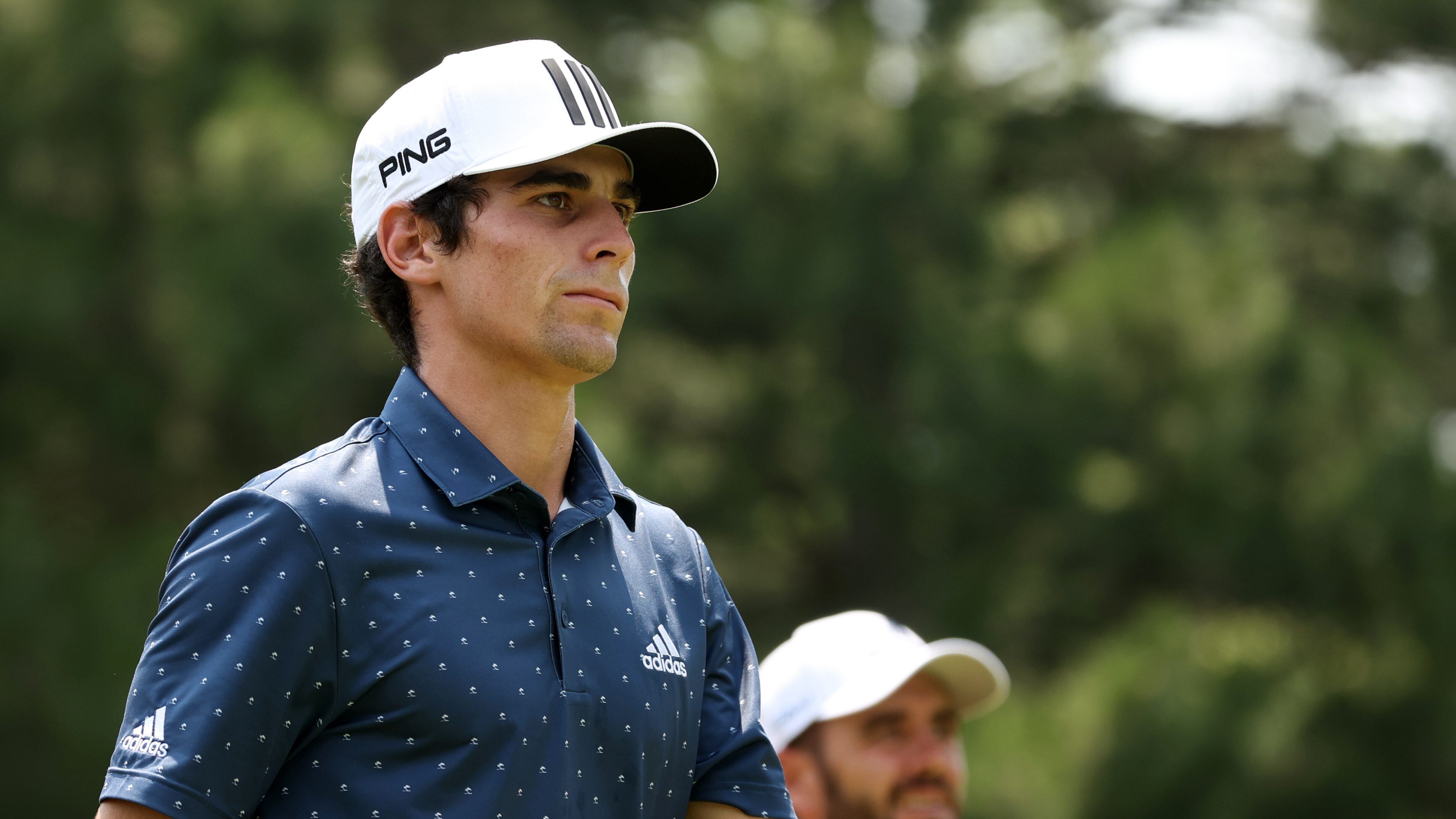 DETROIT, MICHIGAN - JULY 04: Joaquin Niemann of Chile and Troy Merritt prepare to tee off from the fourth tee during the final round of the Rocket Mortgage Classic on July 04, 2021 at the Detroit Golf Club in Detroit, Michigan. (Photo by Gregory Shamus/Getty Images)