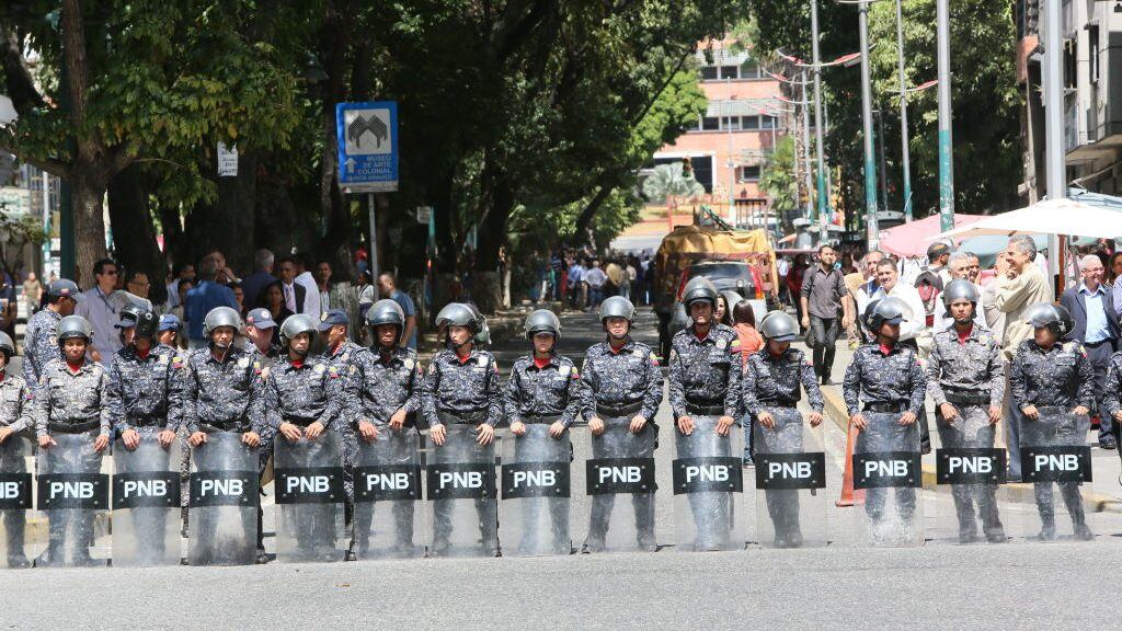 CARACAS, VENEZUELA - JANUARY 30: Riot police awaits for protesters outside ‘Dr. JM de los Rios’ Children’s Hospital during a demonstration against the government of President Nicolás Maduro called by the opposition leader self-proclaimed “acting president” Juan Guaido on January 30, 2019 in Caracas, Venezuela. Guaido is appealing international leaders and military forces to recognize him as the rightful president. (Photo by Edilzon Gamez/Getty Images)