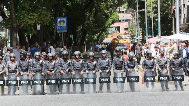 CARACAS, VENEZUELA - JANUARY 30: Riot police awaits for protesters outside ‘Dr. JM de los Rios’ Children’s Hospital during a demonstration against the government of President Nicolás Maduro called by the opposition leader self-proclaimed “acting president” Juan Guaido on January 30, 2019 in Caracas, Venezuela. Guaido is appealing international leaders and military forces to recognize him as the rightful president. (Photo by Edilzon Gamez/Getty Images)