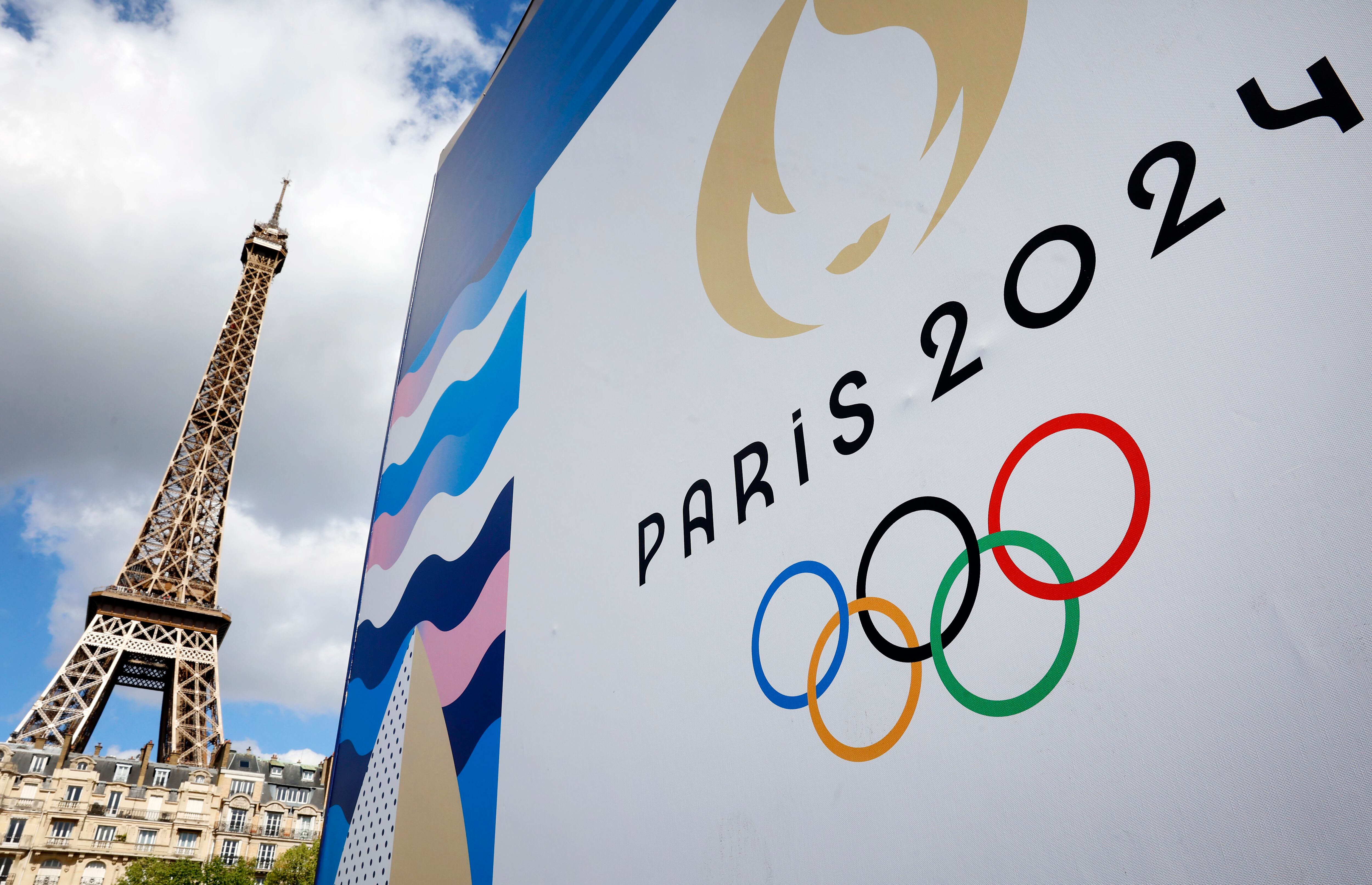 PARIS, FRANCE - APRIL 21: The Paris 2024 logo, representing the Olympic Games is displayed near the Eiffel Tower three months prior to the start of the Paris 2024 Olympic and Paralympic games on April 21, 2024 in Paris, France. The city is gearing up to host the XXXIII Olympic Summer Games, from 26 July to 11 August. (Photo by Chesnot/Getty Images)
