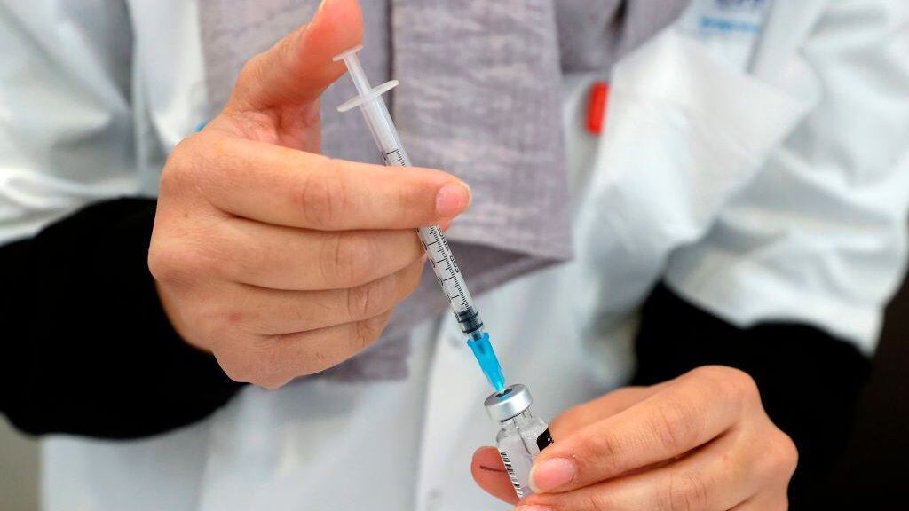 A healthcare worker prepares a dose of COVID-19 vaccine at Maccabi Health Services in the Israeli coastal city of Herzliya, north of Tel Aviv, on December 21, 2020. - Israel has ordered 14 million doses of the vaccine -- covering seven million people, as two doses are required per person for optimal protection -- from Pfizer as well as US biotech firm Moderna. (Photo by JACK GUEZ / AFP) (Photo by JACK GUEZ/AFP via Getty Images)