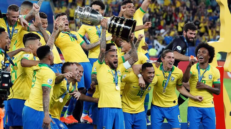 RIO DE JANEIRO, BRAZIL - JULY 07: Dani Alves of Brazil celebrates with the trophy and his teammates after winning during the Copa America Brazil 2019 Final match between Brazil and Peru at Maracana Stadium on July 07, 2019 in Rio de Janeiro, Brazil. (Photo by Koji Watanabe/Getty Images)