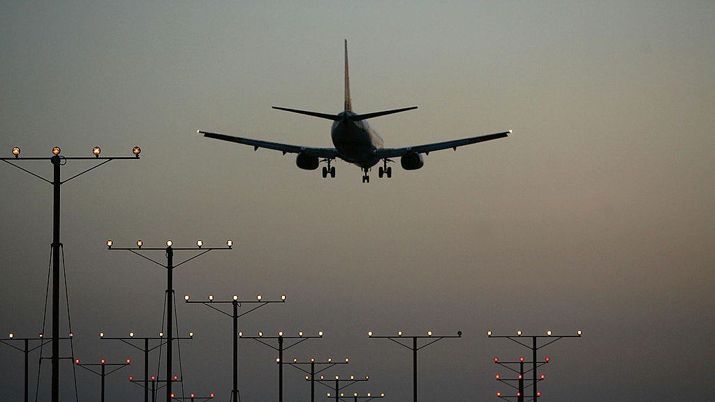 LOS ANGELES, CA - APRIL 15: A jet comes in for landing at Los Angeles International Airport (LAX) on April 15, 2008 in Los Angeles, California. With skyrocketing fuel prices and a weak economy, US airlines are turning to mergers which could ultimately lead to higher fares through reduced flights and increased market power. US carriers emerged from a five-year slump in 2006 but with $35 billion in losses. In the latest merger move to save profits, Delta Air Lines Inc will buy Northwest Airlines Corp for more than $3 billion, creating the world's biggest airline. Recent profit challenges to the industry have lead to the shutdown of ATA, Skybus, and Aloha Airlines as well as bankruptcy for Frontier Airlines. (Photo by David McNew/Getty Images)