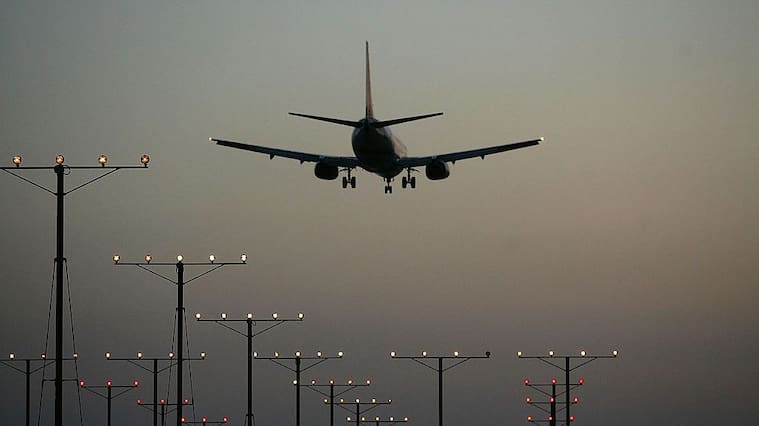 LOS ANGELES, CA - APRIL 15: A jet comes in for landing at Los Angeles International Airport (LAX) on April 15, 2008 in Los Angeles, California. With skyrocketing fuel prices and a weak economy, US airlines are turning to mergers which could ultimately lead to higher fares through reduced flights and increased market power. US carriers emerged from a five-year slump in 2006 but with $35 billion in losses. In the latest merger move to save profits, Delta Air Lines Inc will buy Northwest Airlines Corp for more than $3 billion, creating the world's biggest airline. Recent profit challenges to the industry have lead to the shutdown of ATA, Skybus, and Aloha Airlines as well as bankruptcy for Frontier Airlines. (Photo by David McNew/Getty Images)