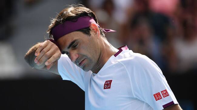 MELBOURNE, AUSTRALIA - JANUARY 28: Roger Federer of Switzerland looks on during his Men’s Singles Quarterfinal match against Tennys Sandgren of the United States on day nine of the 2020 Australian Open at Melbourne Park on January 28, 2020 in Melbourne, Australia. (Photo by Hannah Peters/Getty Images)