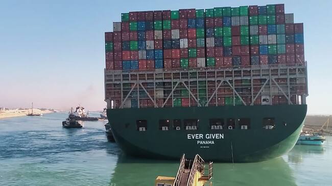 This picture taken on March 29, 2021 from a nearby tugboat in the Suez Canal shows a view of the Panama-flagged MV 'Ever Given' (operated by Taiwan-based Evergreen Marine) container ship as it begins to move. - Egypt's Suez Canal Authority said on March 29 the Ever Given container ship, which has been blocking the crucial waterway for nearly a week, has been "reorientated 80 percent in the right direction". Once it is refloated, it will take three and a half days to clear a traffic jam of hundreds of vessels, authorities said. Over 300 ships are currently waiting to travel through the canal. (Photo by - / AFP) (Photo by -/AFP via Getty Images)