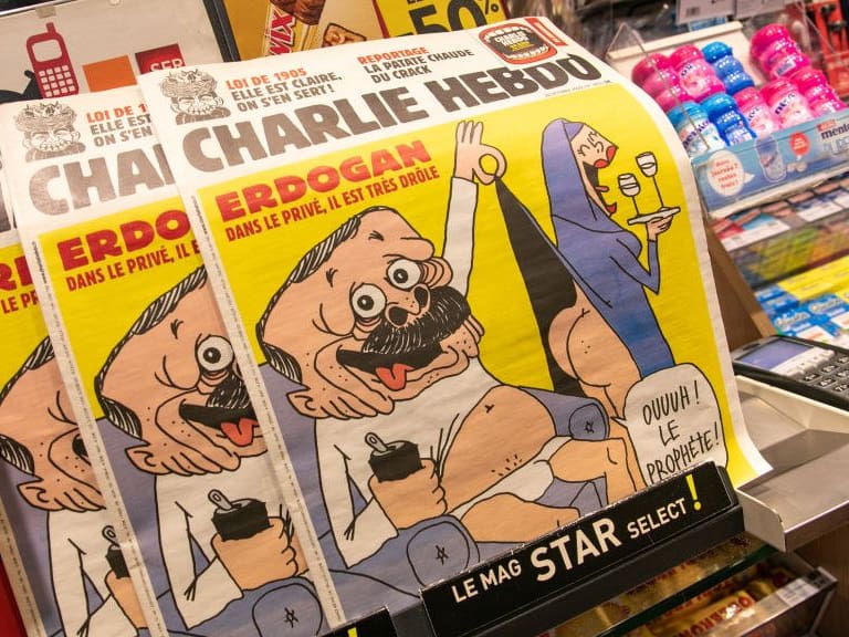 PARIS, FRANCE - OCTOBER 28: French satirical weekly Charlie Hebdo's edition displaying a cover with a satirical drawing representing Turkish President Tayyip Erdogan is displayed for sale on October 28, 2020 in Paris, France. Turkey says it will take legal measures against Charlie Hebdo magazine in Paris after publication of a caricature of Turkish President Erdogan. (Photo by Marc Piasecki/Getty Images)
