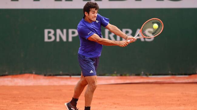 PARIS, FRANCE - JUNE 04: Cristian Garin of Chile plays a backhand during his Men's Singles third round match against Marcos Giron of USA during day six of the 2021 French Open at Roland Garros on June 04, 2021 in Paris, France. (Photo by Julian Finney/Getty Images)