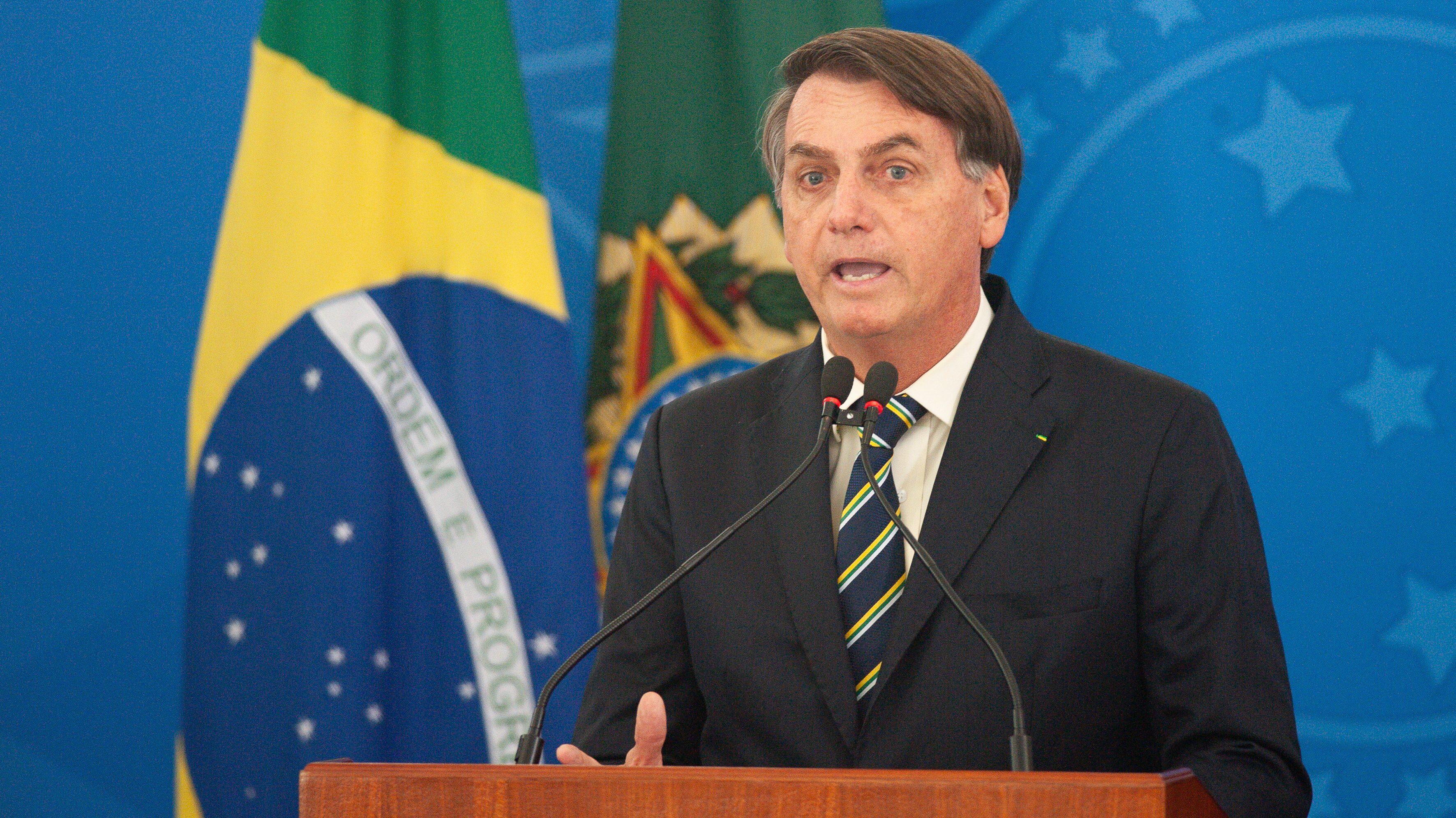 BRASILIA, BRAZIL - MARCH 27: President of Brazil Jair Bolsonaro speaks in the press conference about credit for entrepreneurs to guarantee wages during coronavirus (COVID - 19) pandemic at the Planalto Palace on March, 27, 2020 in Brasilia, Brazil. Brazil has 3,027 confirmed cases Coronavirus (COVID-19) and 77 deaths. (Photo by Andressa Anholete/Getty Images)