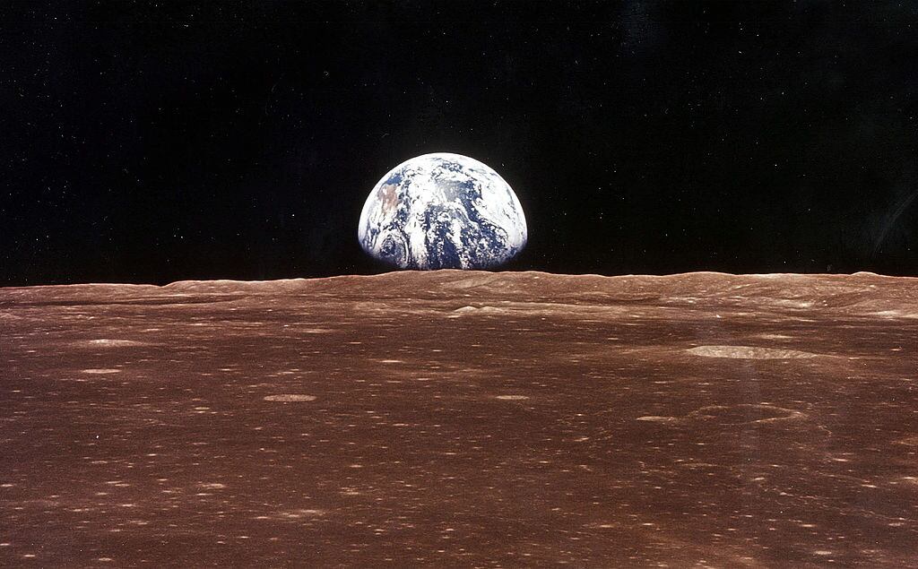 376713 11: (FILE PHOTO) A view of the Earth appears over the Lunar horizon as the Apollo 11 Command Module comes into view of the Moon before Astronatus Neil Armstrong and Edwin Aldrin Jr. leave in the Lunar Module, Eagle, to become the first men to walk on the Moon's surface. The 30th anniversary of the Apollo 11 Moon mission is celebrated July 20, 1999. (Photo by NASA/Newsmakers)