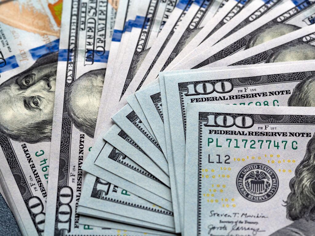 UKRAINE - 2021/05/08: In this photo illustration 100-dollar bills seen displayed. (Photo Illustration by Igor Golovniov/SOPA Images/LightRocket via Getty Images)