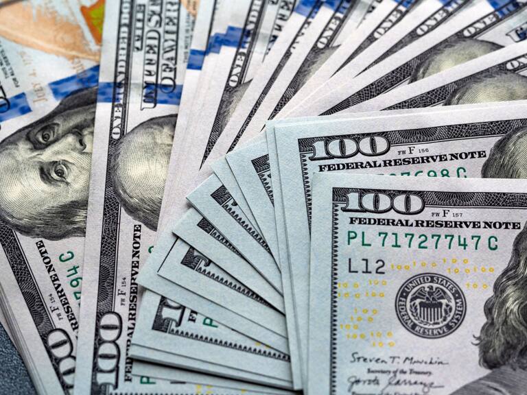 UKRAINE - 2021/05/08: In this photo illustration 100-dollar bills seen displayed. (Photo Illustration by Igor Golovniov/SOPA Images/LightRocket via Getty Images)