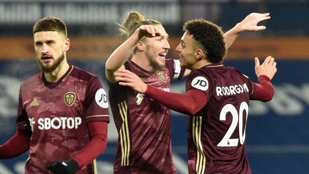 WEST BROMWICH, ENGLAND - DECEMBER 29: Luke Ayling of Leeds United and Rodrigo Moreno of Leeds United celebrate after their team's first goal, an own goal by Romaine Sawyers of West Bromwich Albion (not pictured) during the Premier League match between West Bromwich Albion and Leeds United at The Hawthorns on December 29, 2020 in West Bromwich, England. The match will be played without fans, behind closed doors as a Covid-19 precaution. (Photo by Rui Vieira - Pool/Getty Images)