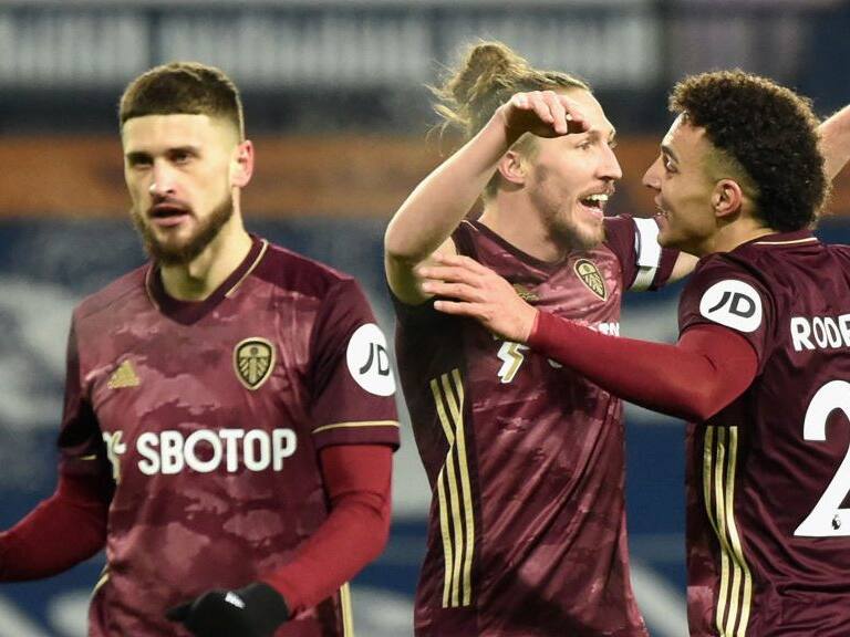 WEST BROMWICH, ENGLAND - DECEMBER 29: Luke Ayling of Leeds United and Rodrigo Moreno of Leeds United celebrate after their team's first goal, an own goal by Romaine Sawyers of West Bromwich Albion (not pictured) during the Premier League match between West Bromwich Albion and Leeds United at The Hawthorns on December 29, 2020 in West Bromwich, England. The match will be played without fans, behind closed doors as a Covid-19 precaution. (Photo by Rui Vieira - Pool/Getty Images)