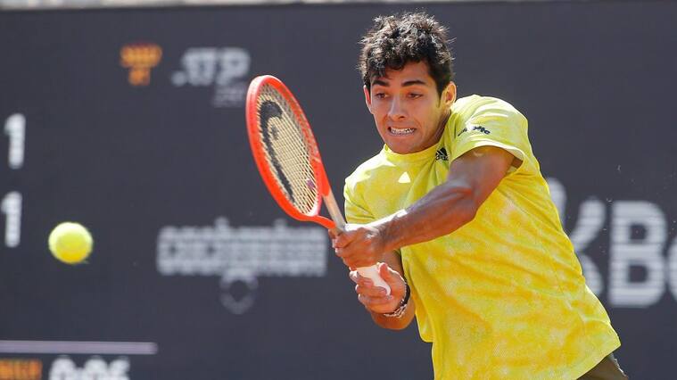 SANTIAGO, CHILE - MARCH 14: Cristian Garin of Chile plays a backhand against Facundo Bagnis of Argentina during the final of Chile Dove Men+Care Open at Club Deportivo Universidad Catolica on March 14, 2021 in Santiago, Chile. (Photo by Marcelo Hernandez/Getty Images)