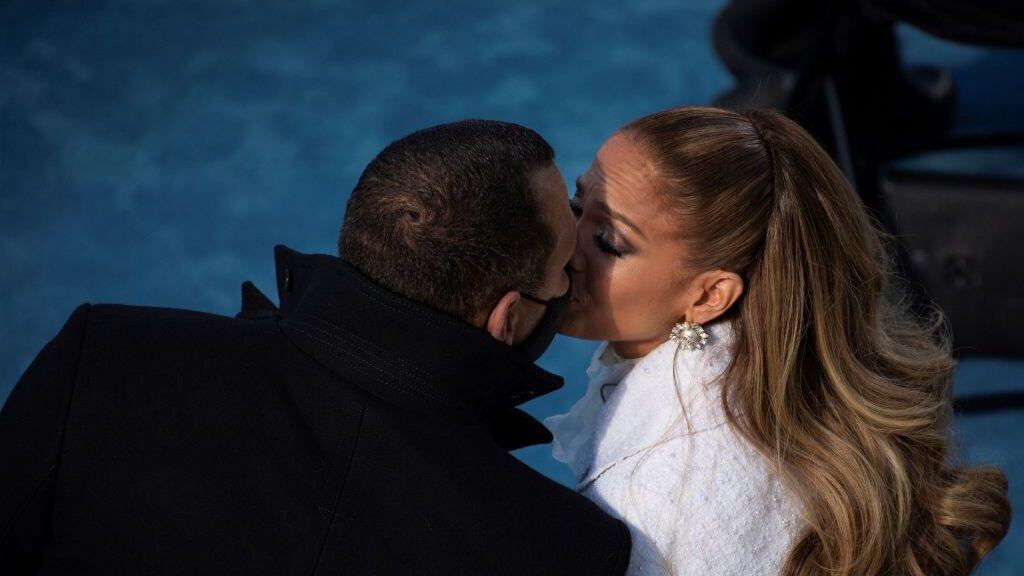 Jennifer Lopez (R) kisses fiancé Alex Rodriguez (L) after performing during the inauguration of Joe Biden as the 46th US President on January 20, 2021, at the US Capitol in Washington, DC. (Photo by Caroline Brehman / POOL / AFP) (Photo by CAROLINE BREHMAN/POOL/AFP via Getty Images)