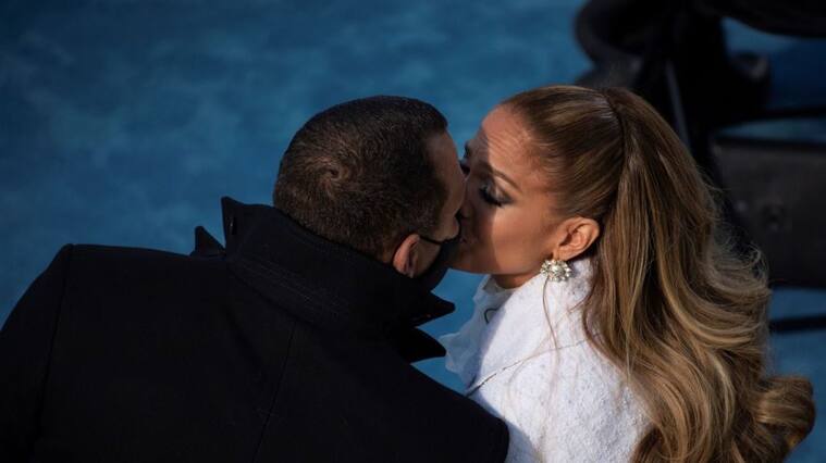 Jennifer Lopez (R) kisses fiancé Alex Rodriguez (L) after performing during the inauguration of Joe Biden as the 46th US President on January 20, 2021, at the US Capitol in Washington, DC. (Photo by Caroline Brehman / POOL / AFP) (Photo by CAROLINE BREHMAN/POOL/AFP via Getty Images)