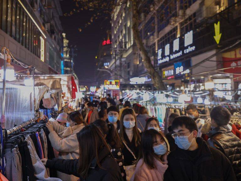 WUHAN, CHINA - JANUARY 26: Citizens wearing face masks at a local open-air market on January 26, 2021 in Wuhan, China. In order to curb the spread of the new crown pneumonia COVID-19 disease, the Chinese government closed the city of Wuhan for 76 days starting January 23, 2020. (Photo by Lintao Zhang/Getty Images)