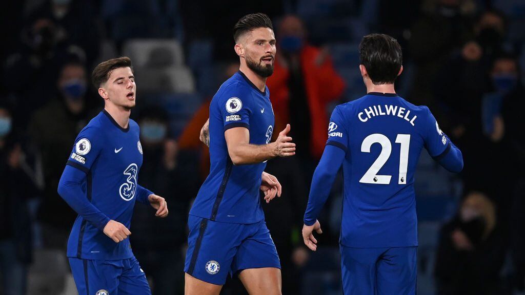 LONDON, ENGLAND - DECEMBER 05: Olivier Giroud of Chelsea celebrates with team mate Ben Chilwell after scoring his sides first goal during the Premier League match between Chelsea and Leeds United at Stamford Bridge on December 05, 2020 in London, England. A limited number of fans are welcomed back to stadiums to watch elite football across England. This was following easing of restrictions on spectators in tiers one and two areas only. (Photo by Darren Walsh/Chelsea FC via Getty Images)