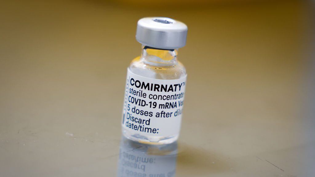 09 March 2021, Schleswig-Holstein, Hooge: An empty vial with the vaccine from Biontech/Pfizer stands on a table in the hospital room on the Hallig. The first Hallig residents were vaccinated against Corona on Hooge on Tuesday. Photo: Christian Charisius/dpa (Photo by Christian Charisius/picture alliance via Getty Images)