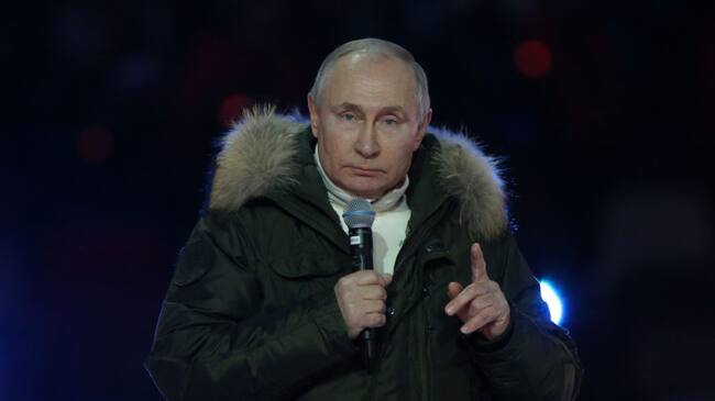 MOSCOW, RUSSIA - MARCH 18: (RUSSIA OUT) Russian President Vladimir Putin speaks during a concert marking the 7th anniversary of Crimea annexation, on March 18, 2021in Moscow, Russia. Tens thousands of people gathered at Luzhniki Stadium to watch a patriotic concert called "The days of Crimea". (Photo by Mikhail Svetlov/Getty Images)