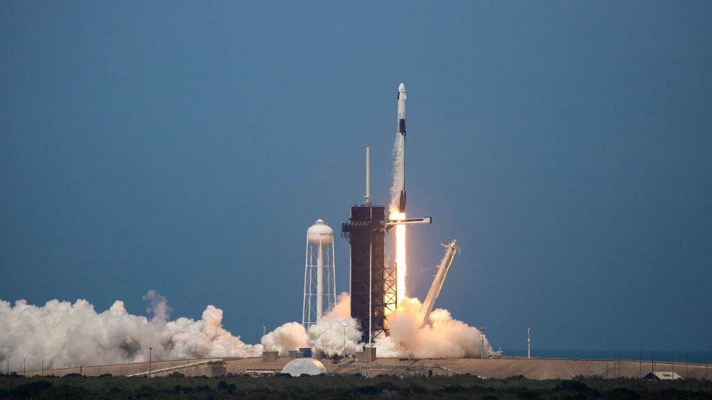 CAPE CANAVERAL, FLORIDA - MAY 30: The SpaceX Falcon 9 rocket launches into space with NASA astronauts Bob Behnken (R) and Doug Hurley aboard the rocket from the Kennedy Space Center on May 30, 2020 in Cape Canaveral, Florida. The inaugural flight is the first manned mission since the end of the Space Shuttle program in 2011 to be launched into space from the United States. (Photo by Saul Martinez/Getty Images)