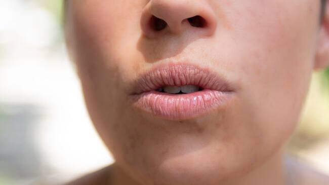 Close up to a woman mouth showing expressions