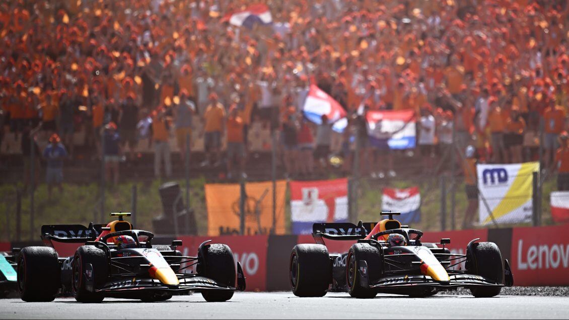 BARCELONA, SPAIN - MAY 22: Race winner Max Verstappen of the Netherlands driving the (1) Oracle Red Bull Racing RB18 and Second placed Sergio Perez of Mexico driving the (11) Oracle Red Bull Racing RB18 on the slow down lap during the F1 Grand Prix of Spain at Circuit de Barcelona-Catalunya on May 22, 2022 in Barcelona, Spain. (Photo by Clive Mason/Getty Images)