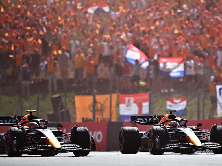 BARCELONA, SPAIN - MAY 22: Race winner Max Verstappen of the Netherlands driving the (1) Oracle Red Bull Racing RB18 and Second placed Sergio Perez of Mexico driving the (11) Oracle Red Bull Racing RB18 on the slow down lap during the F1 Grand Prix of Spain at Circuit de Barcelona-Catalunya on May 22, 2022 in Barcelona, Spain. (Photo by Clive Mason/Getty Images)