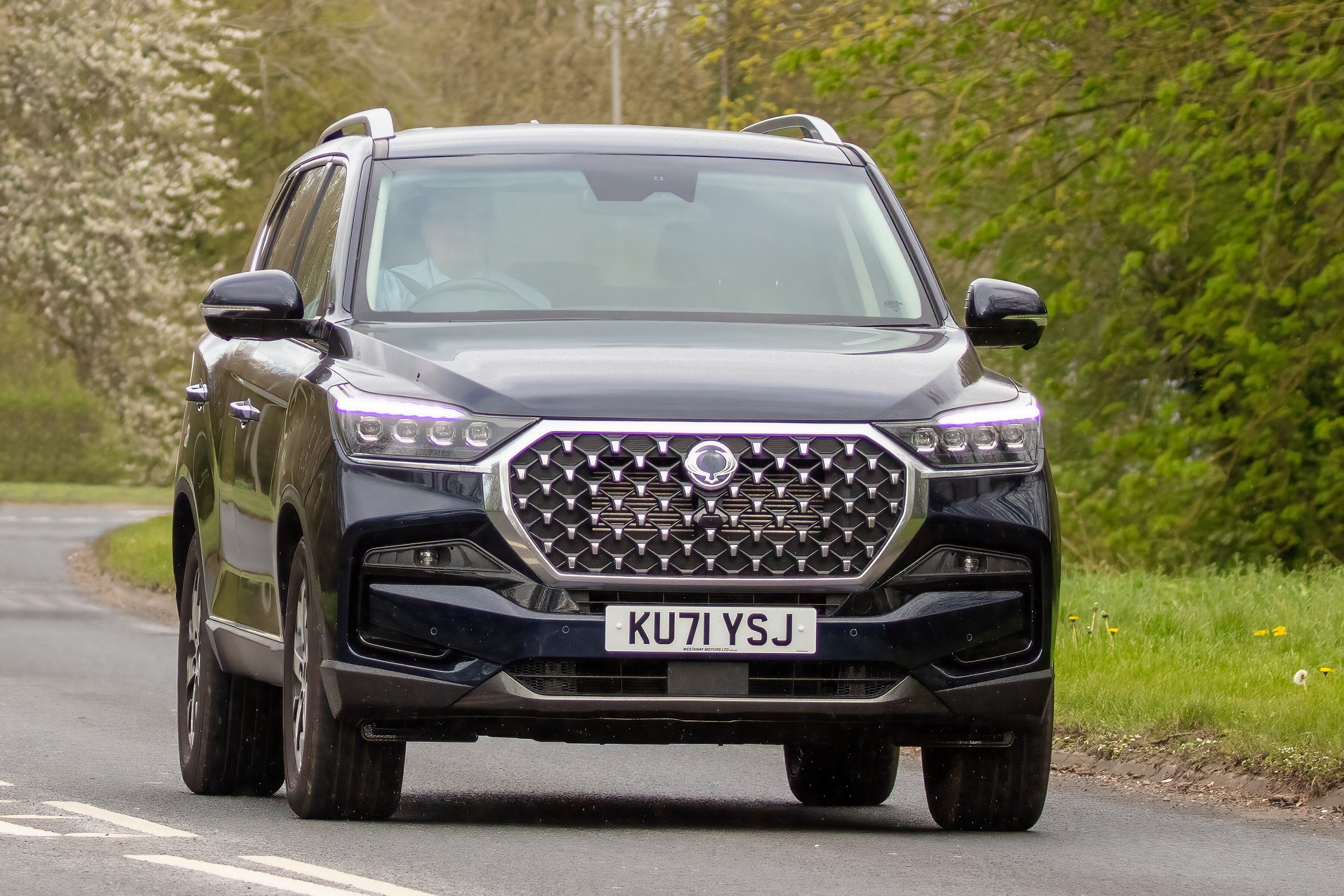 Milton Keynes, Bucks, UK - April 13th 2022. 2022 SSANGYONG Rexton large SUV driving on an English country road