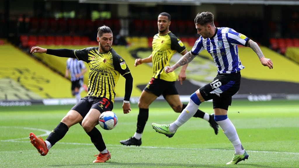 WATFORD, ENGLAND - APRIL 02: Josh Windass of Sheffield Wednesday has a shot blocked by Francisco Sierralta of Watford during the Sky Bet Championship match between Watford and Sheffield Wednesday at Vicarage Road on April 02, 2021 in Watford, England. Sporting stadiums around the UK remain under strict restrictions due to the Coronavirus Pandemic as Government social distancing laws prohibit fans inside venues resulting in games being played behind closed doors. (Photo by Richard Heathcote/Getty Images)