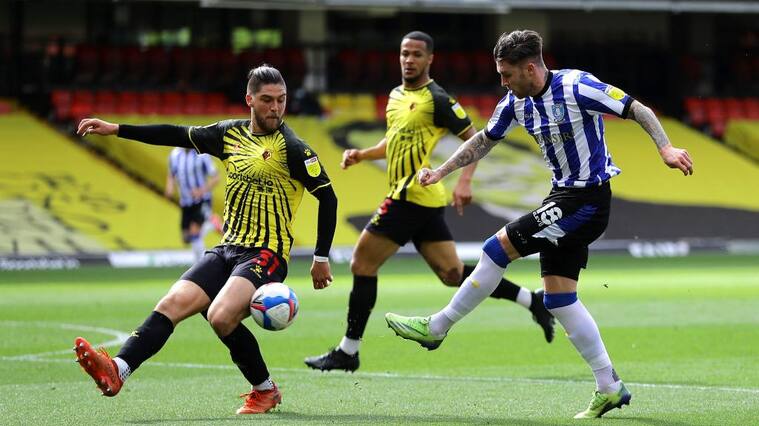 WATFORD, ENGLAND - APRIL 02: Josh Windass of Sheffield Wednesday has a shot blocked by Francisco Sierralta of Watford during the Sky Bet Championship match between Watford and Sheffield Wednesday at Vicarage Road on April 02, 2021 in Watford, England. Sporting stadiums around the UK remain under strict restrictions due to the Coronavirus Pandemic as Government social distancing laws prohibit fans inside venues resulting in games being played behind closed doors. (Photo by Richard Heathcote/Getty Images)