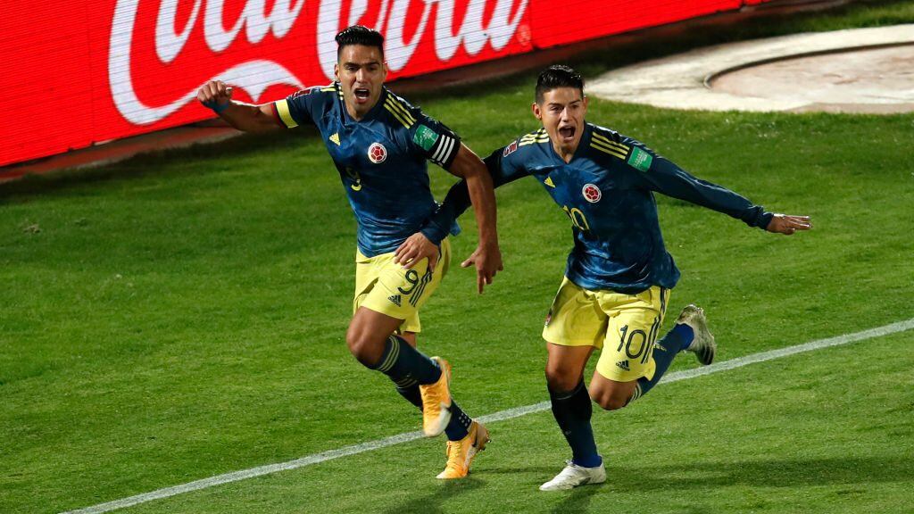 SANTIAGO, CHILE - OCTOBER 13: Radamel Falcao of Colombia celebrates after scoring the the second goal of his team with teammate James Rodríguez during a match between Chile and Colombia as part of South American Qualifiers for Qatar 2022 at Estadio Nacional de Chile on October 13, 2020 in Santiago, Chile. (Photo by Alberto Valdes-Pool/Getty Images)