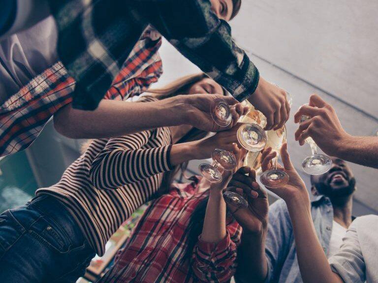 Close up of young managers having drink together
