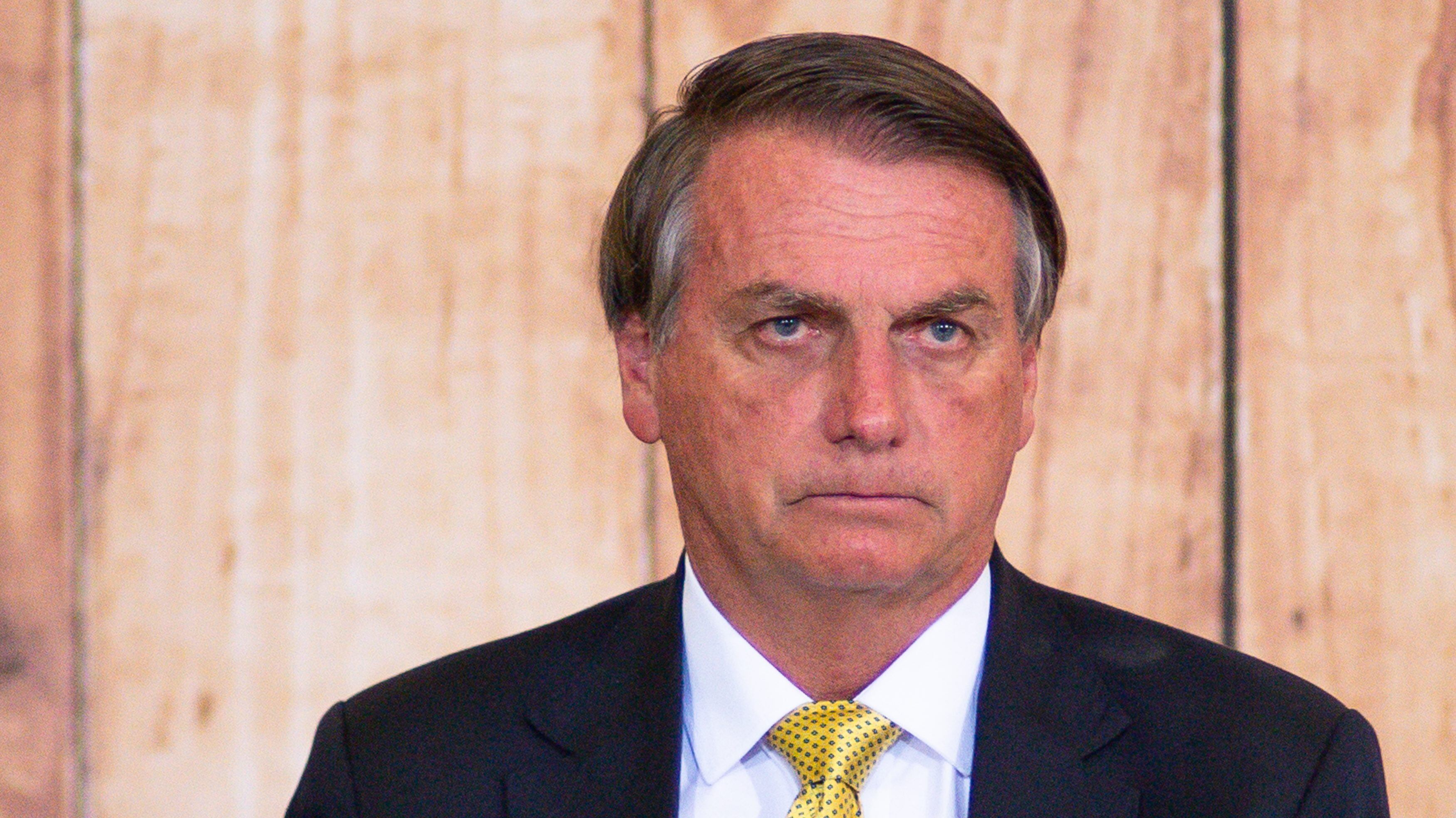 BRASILIA, BRAZIL - DECEMBER 13: President of Brazil Jair Bolsonaro looks on during an event to celebrate the national day of Northeastern Brazilian folk music Forró on December 13, 2021 in Brasilia, Brazil.  (Photo by Andressa Anholete/Getty Images)