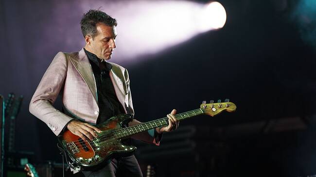 LEEDS, UNITED KINGDOM - AUGUST 28: Steve Mackey of Pulp performs on stage during day three of Leeds Festival at Bramham Park on August 28, 2011 in Leeds, United Kingdom. (Photo by Gary Wolstenholme/Redferns)