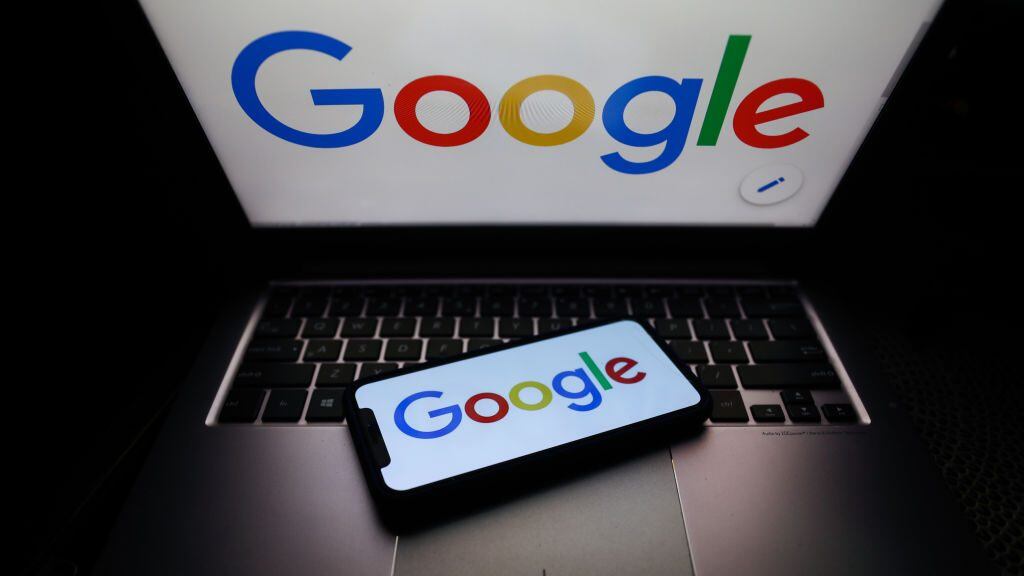Google logo displayed on phone and laptop screens are seen in this illustration photo taken on October 18, 2020. (Photo Illustration by Jakub Porzycki/NurPhoto via Getty Images)