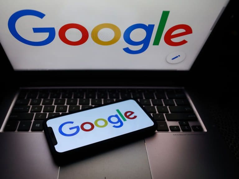 Google logo displayed on phone and laptop screens are seen in this illustration photo taken on October 18, 2020.  (Photo Illustration by Jakub Porzycki/NurPhoto via Getty Images)