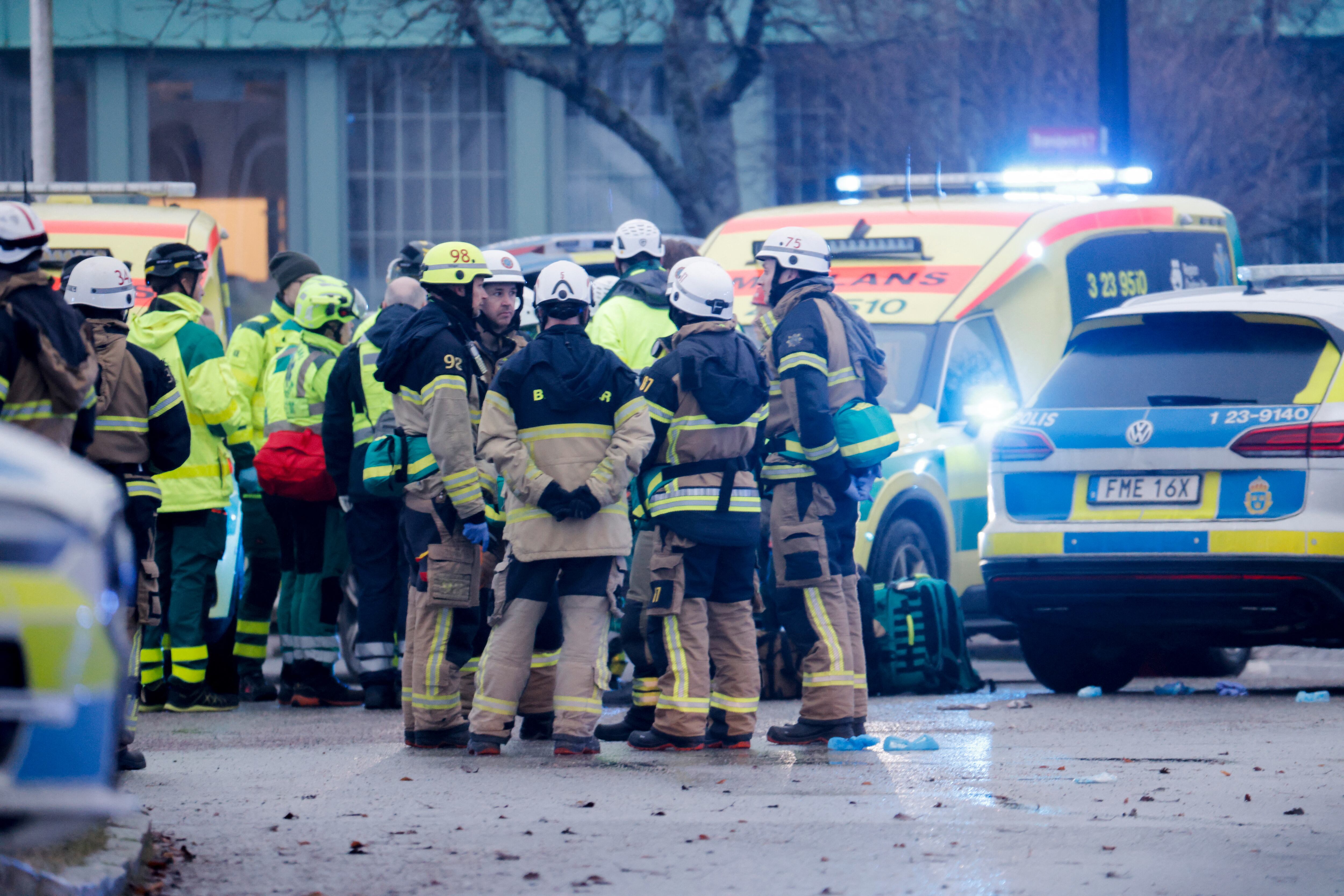 Members of the emergengy services work at the scene of the Risbergska School in Orebro, Sweden, on February 4, 2025, following reports of a serious violent crime. Four people were shot at a school in the Swedish city of Orebro on Tuesday, police said while adding that a large operation was still ongoing, urging people to stay away from the area. (Photo by Kicki NILSSON / TT News Agency / AFP) / Sweden OUT (Photo by KICKI NILSSON/TT News Agency/AFP via Getty Images)