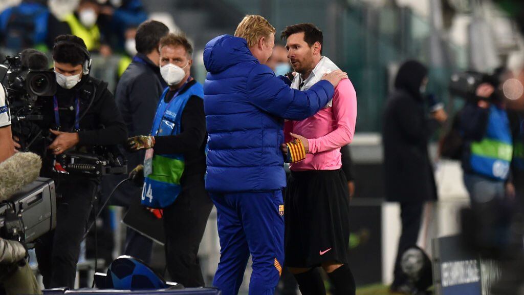 TURIN, ITALY - OCTOBER 28: Ronald Koeman, Head Coach of Barcelona and Lionel Messi of Barcelona speak during the UEFA Champions League Group G stage match between Juventus and FC Barcelona at Juventus Stadium on October 28, 2020 in Turin, Italy. Sporting stadiums around Italy remain under strict restrictions due to the Coronavirus Pandemic as Government social distancing laws prohibit fans inside venues resulting in games being played behind closed doors. (Photo by Tullio Puglia - UEFA/UEFA via Getty Images)