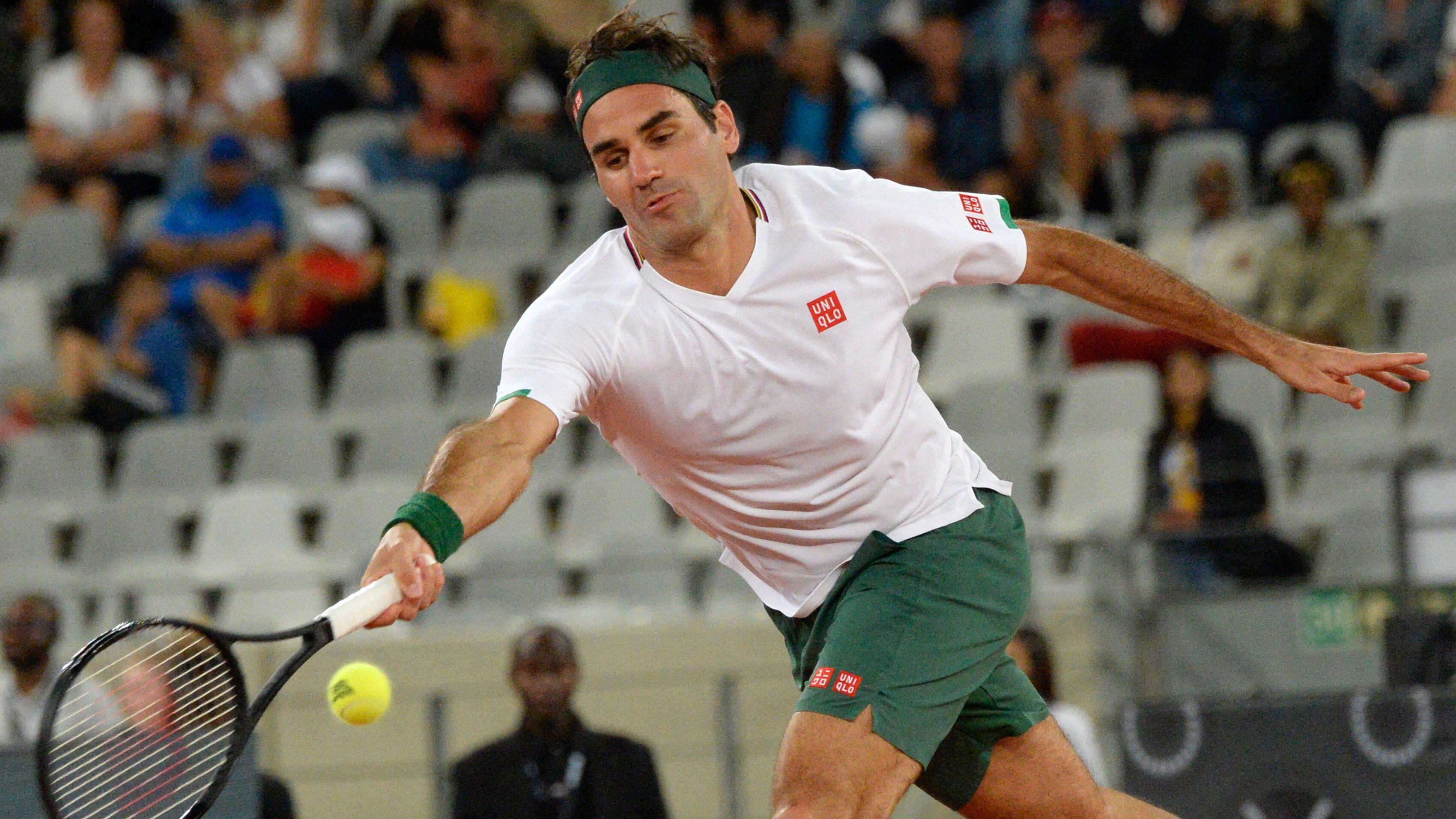 Switzerland's Roger Federer plays a return to Spain's Rafael Nadal during their tennis match at The Match in Africa at the Cape Town Stadium, in Cape Town on February 7, 2020. (Photo by RODGER BOSCH / AFP) (Photo by RODGER BOSCH/AFP via Getty Images)