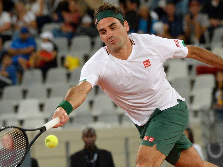 Switzerland's Roger Federer plays a return to Spain's Rafael Nadal during their tennis match at The Match in Africa at the Cape Town Stadium, in Cape Town on February 7, 2020. (Photo by RODGER BOSCH / AFP) (Photo by RODGER BOSCH/AFP via Getty Images)