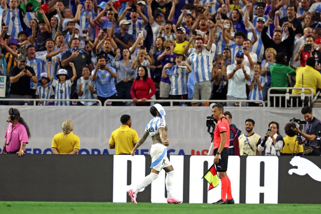 Argentina's defender #19 Nicolas Otamendi celebrates after scoring a goal during a penalty shoot out to win the Conmebol 2024 Copa America tournament quarter-final football match between Argentina and Ecuador at NRG Stadium in Houston, Texas, on July 4, 2024. (Photo by CHARLY TRIBALLEAU / AFP) (Photo by CHARLY TRIBALLEAU/AFP via Getty Images)