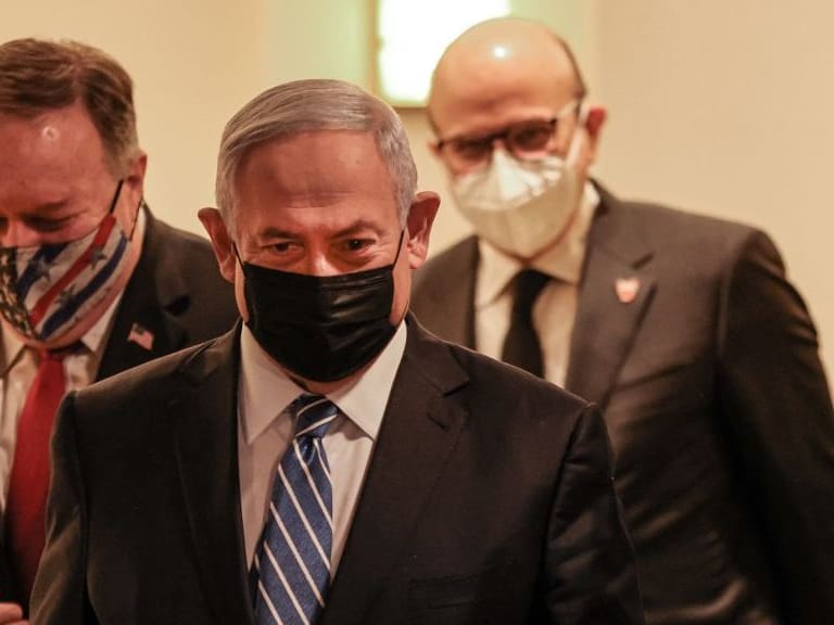 (L to R) US Secretary of State Mike Pompeo, Israeli Prime Minister Benjamin Netanyahu, and Bahrain&#039;s Foreign Minister Abdullatif bin Rashid Al Zayani, all mask-clad due to the COVID-19 coronavirus pandemic, arrive for a press conference after their trilateral meeting in Jerusalem on November 18, 2020. (Photo by Menahem KAHANA / POOL / AFP) (Photo by MENAHEM KAHANA/POOL/AFP via Getty Images)