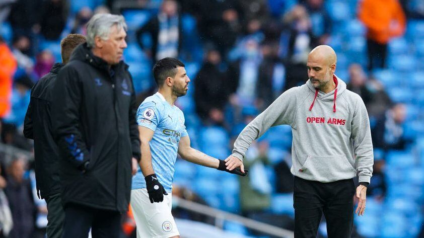 MANCHESTER, ENGLAND - MAY 23: Sergio Aguero of Manchester City speaks with Pep Guardiola, Manager of Manchester City as he is substituted on during the Premier League match between Manchester City and Everton at Etihad Stadium on May 23, 2021 in Manchester, England. A limited number of fans will be allowed into Premier League stadiums as Coronavirus restrictions begin to ease in the UK. (Photo by Dave Thompson - Pool/Getty Images)