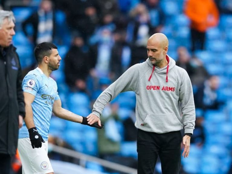 MANCHESTER, ENGLAND - MAY 23: Sergio Aguero of Manchester City speaks with Pep Guardiola, Manager of Manchester City as he is substituted on during the Premier League match between Manchester City and Everton at Etihad Stadium on May 23, 2021 in Manchester, England. A limited number of fans will be allowed into Premier League stadiums as Coronavirus restrictions begin to ease in the UK. (Photo by Dave Thompson - Pool/Getty Images)