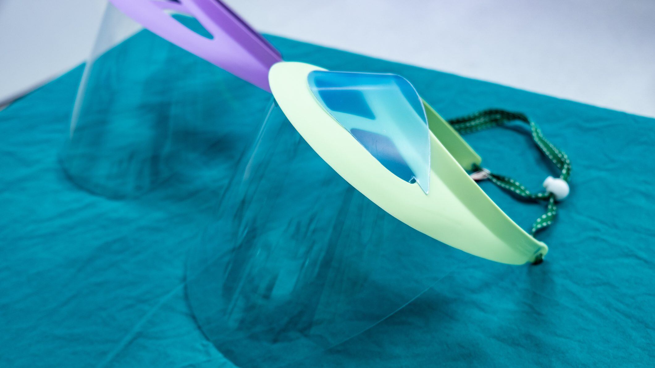 Face shield is a device to protect the wearer's face from objects, chemical or even virus diseases.
