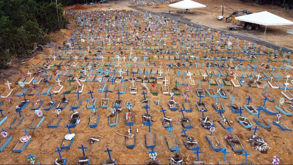 TOPSHOT - Aerial view of an area at the Nossa Senhora Aparecida cemetery where new graves have been dug in Manaus, Brazil, on May 22, 2020 amid the novel Covid-19 coronavirus pandemic. - Brazil, the hardest-hit Latin American country in the coronavirus pandemic, has surpassed 20,000 deaths, according to Brazil's Ministry of Health (Photo by MICHAEL DANTAS / AFP) (Photo by MICHAEL DANTAS/AFP via Getty Images)