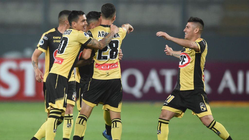 Chile's Coquimbo players celebrate after scoring against Peru's Sport Huancayo during their closed-door Copa Sudamericana round before the quarterfinals football match at the National Stadium in Lima, on December 2, 2020. (Photo by ERNESTO BENAVIDES / AFP) (Photo by ERNESTO BENAVIDES/AFP via Getty Images)